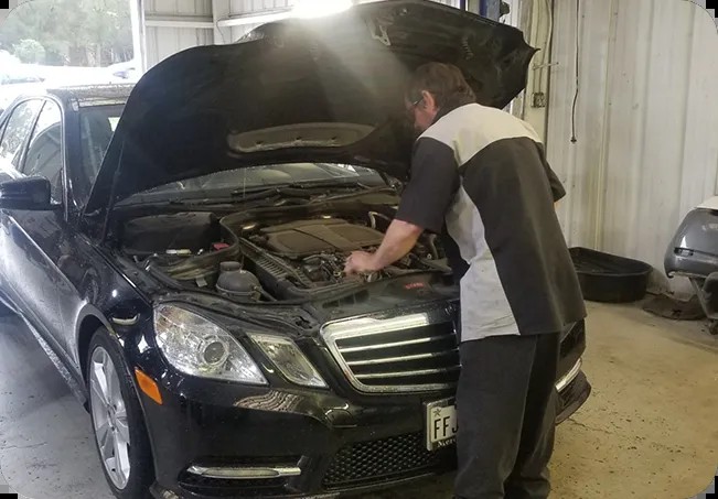 A Dearing technician servicing a vehicle